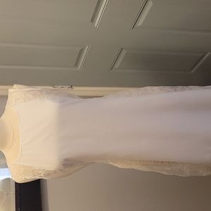 Gorgeous white long dress with lace down the sides.